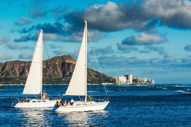 2 sail boats with Diamond Head in background.