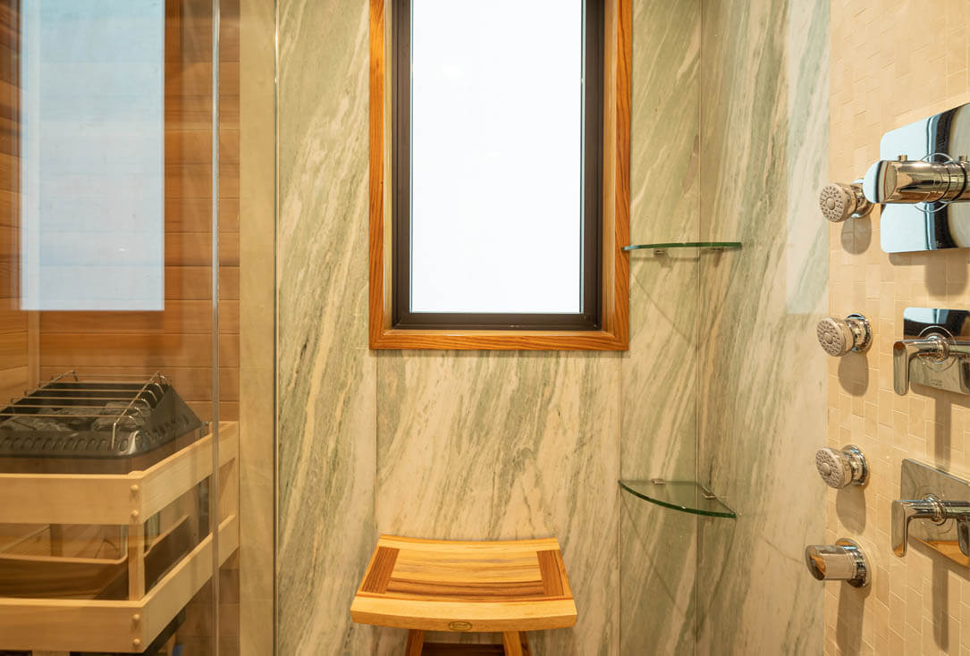 In-suite sauna and marble shower.