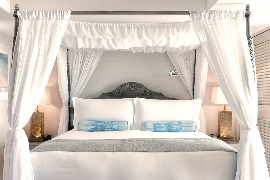 Master guest rooms feature canopy beds and luxurious bedding.