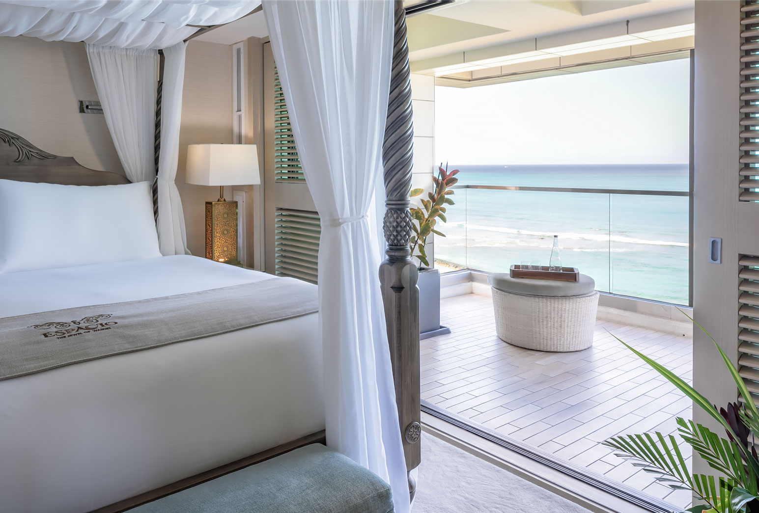 Master bedroom with sliding door opening to the balcony.