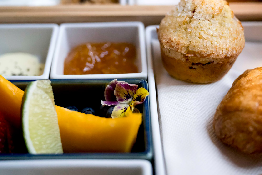 Breakfast pastries, fruit and jam.