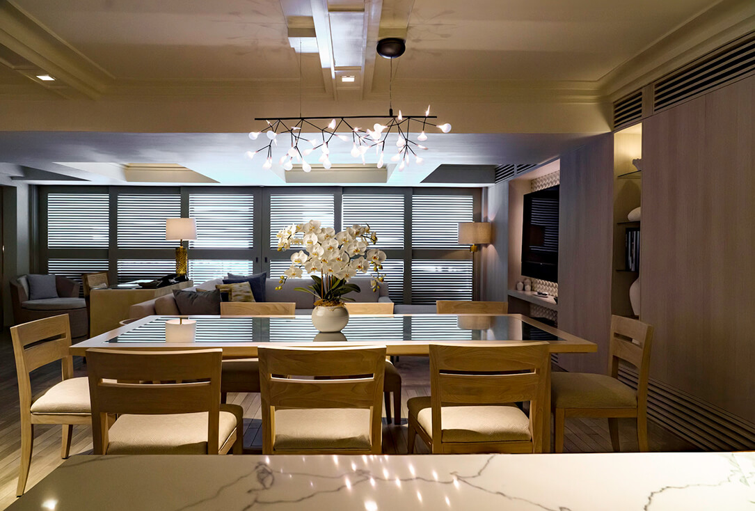 Dining area with a table, chairs, and living room.